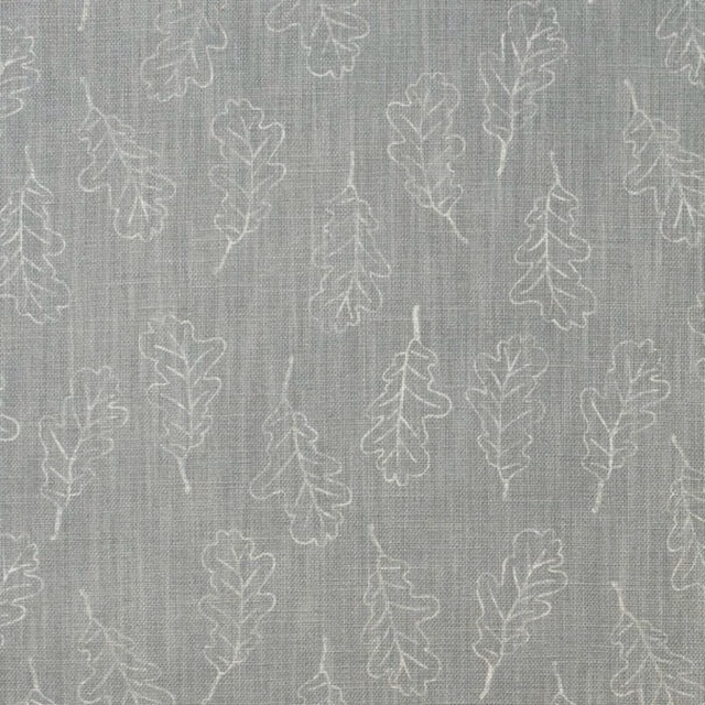 Cool grey woven fabric with ivory oak leaf outlines and fine vertical texture