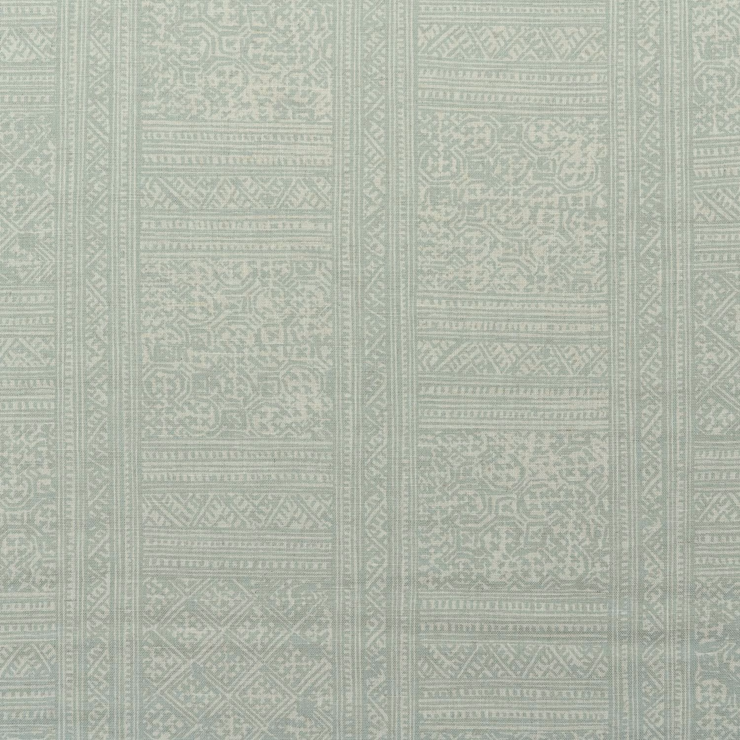 Pale celadon green textile with distressed geometric panels and ornate vertical bands