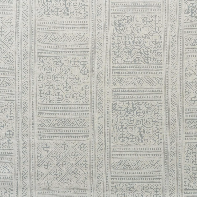 Pale storm-grey and ivory fabric with vertical geometric and ornamental woven-looking panels