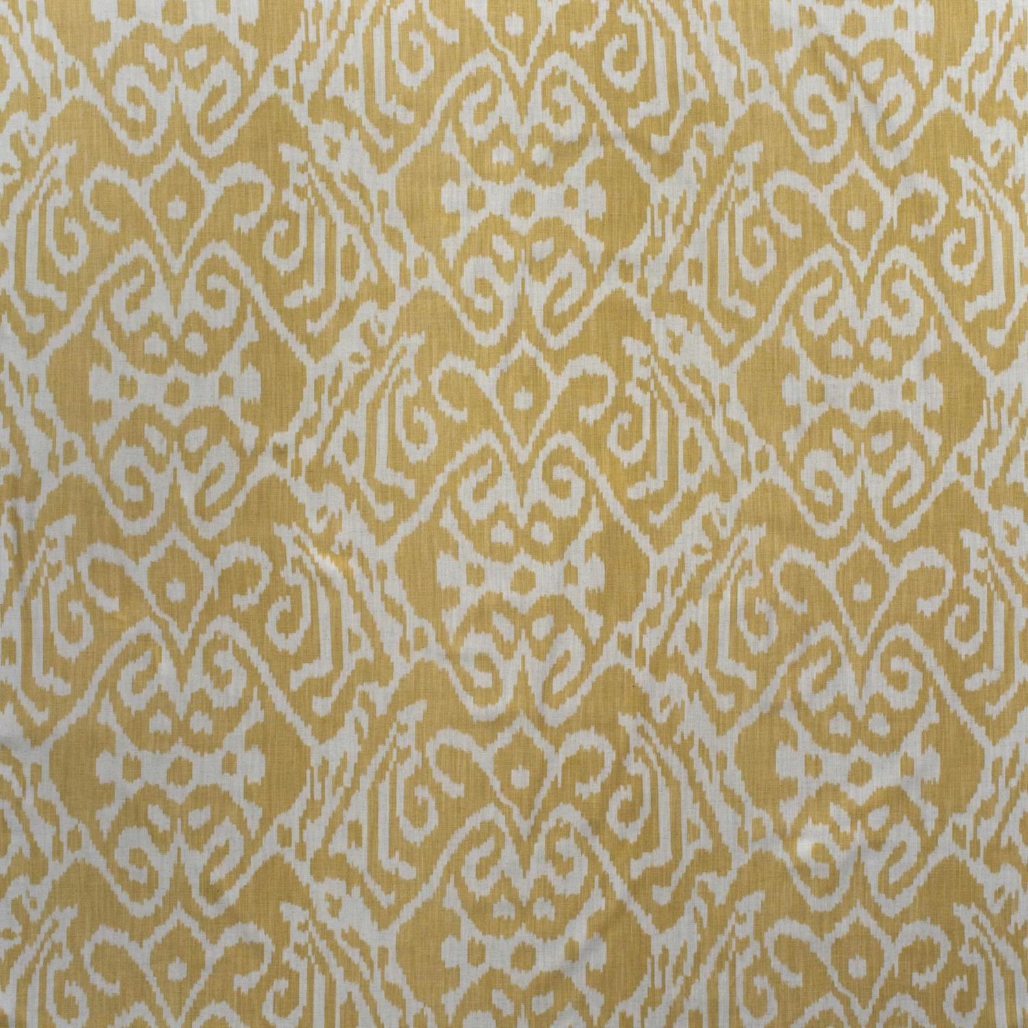 Warm barley-gold ikat curls over a pale otter-beige cotton ground