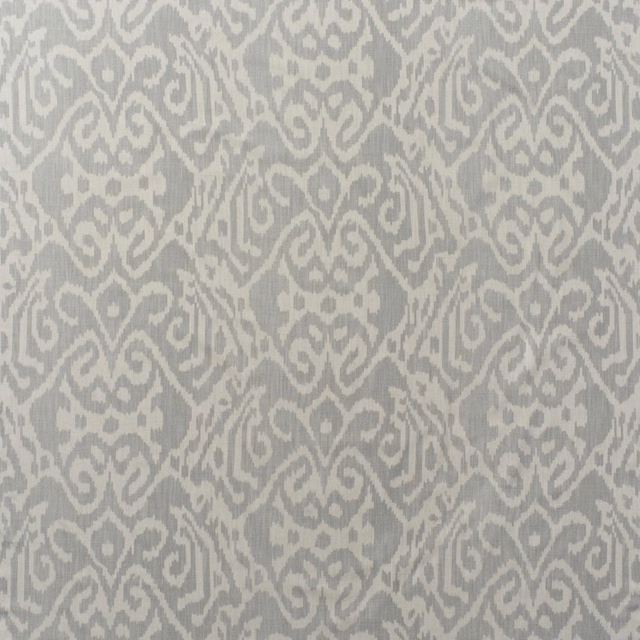 Cool grey ikat scroll motifs on a pale cloud cotton ground