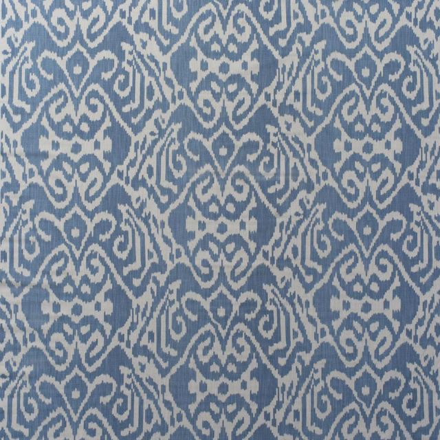 Muted denim-blue and ivory ikat motifs in a softly textured cotton print