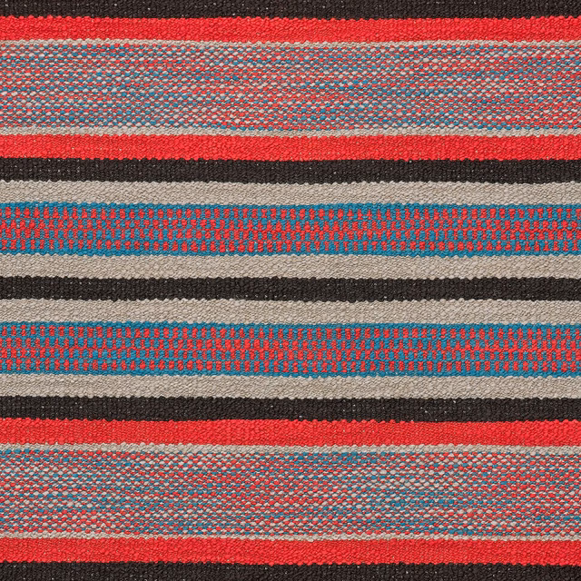 Red, teal, charcoal and cream horizontal stripes in a richly textured woven cloth