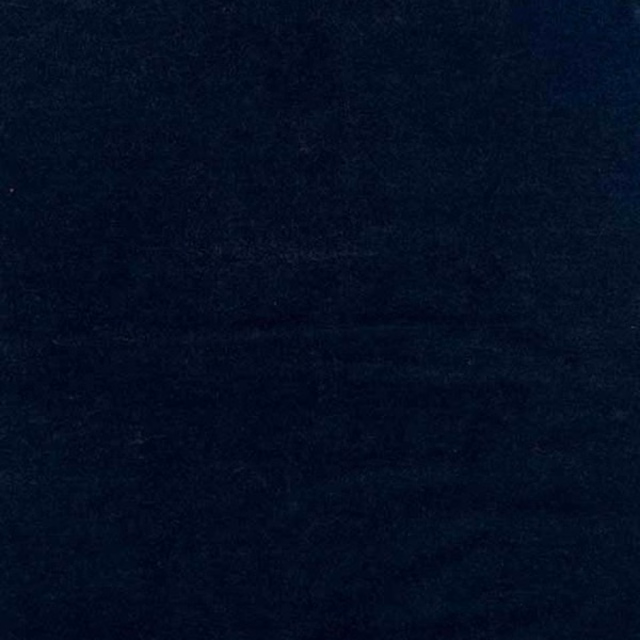 Deep denim-blue fabric with subtle mottled shading and a softly brushed surface
