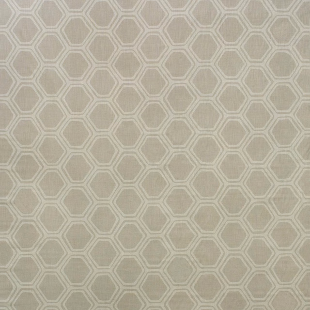 Pale taupe woven fabric with a cream interlocking hexagonal lattice