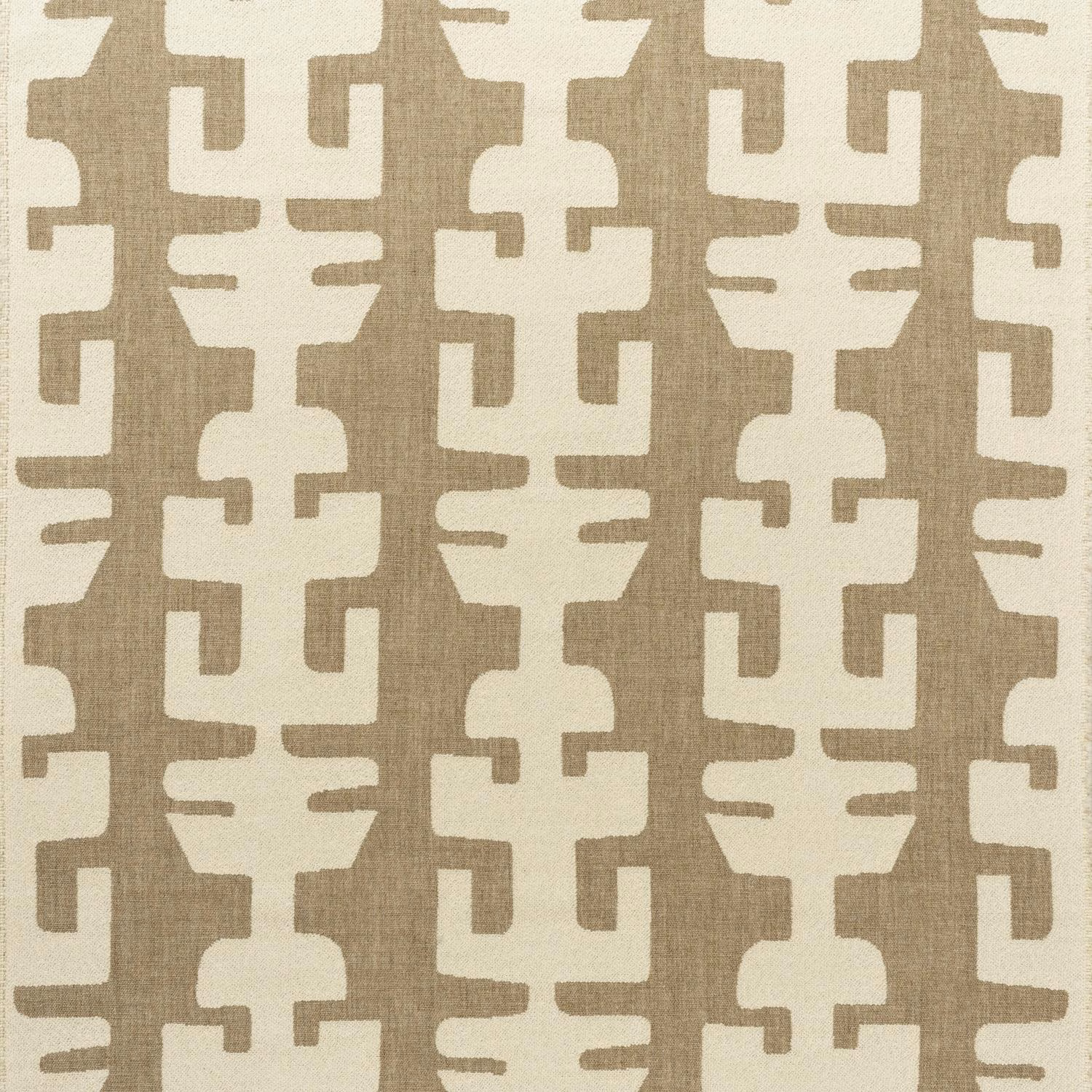 Warm ivory and taupe interlocking geometric fabric with a visibly textured woven surface