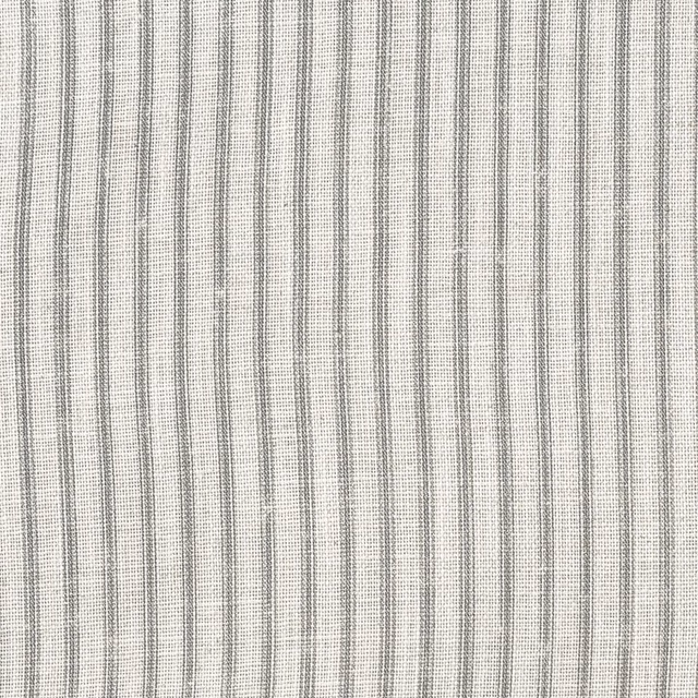 Pale cloud-grey woven swatch with narrow, irregular charcoal vertical stripes