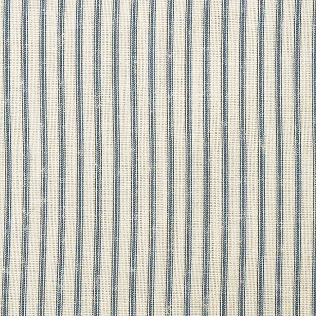 Muted denim-blue vertical stripes woven across a warm cream fabric ground