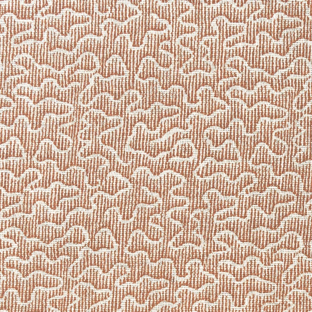 Warm orange ribbed fabric with dense cream abstract squiggle pattern