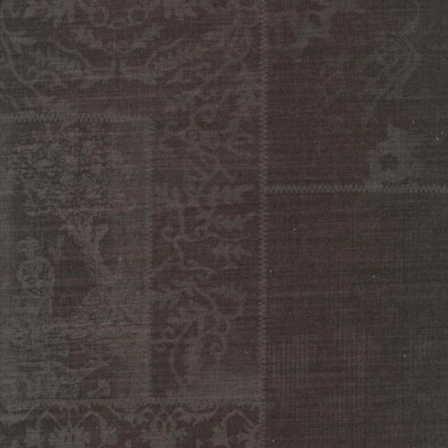Dark taupe woven fabric with faded patchwork motifs and a softly distressed surface