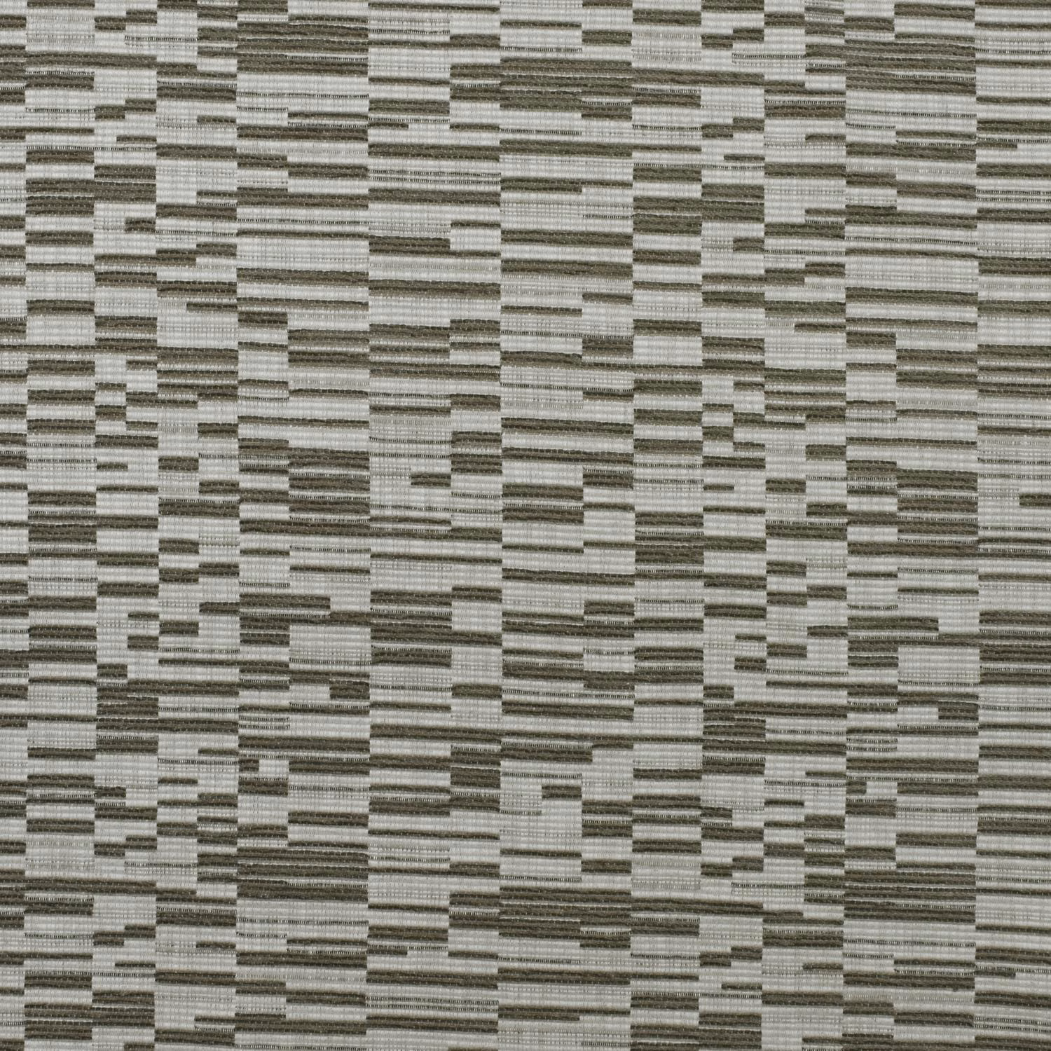 Close-up of ribbed grey fabric with irregular pale and charcoal rectangular blocks