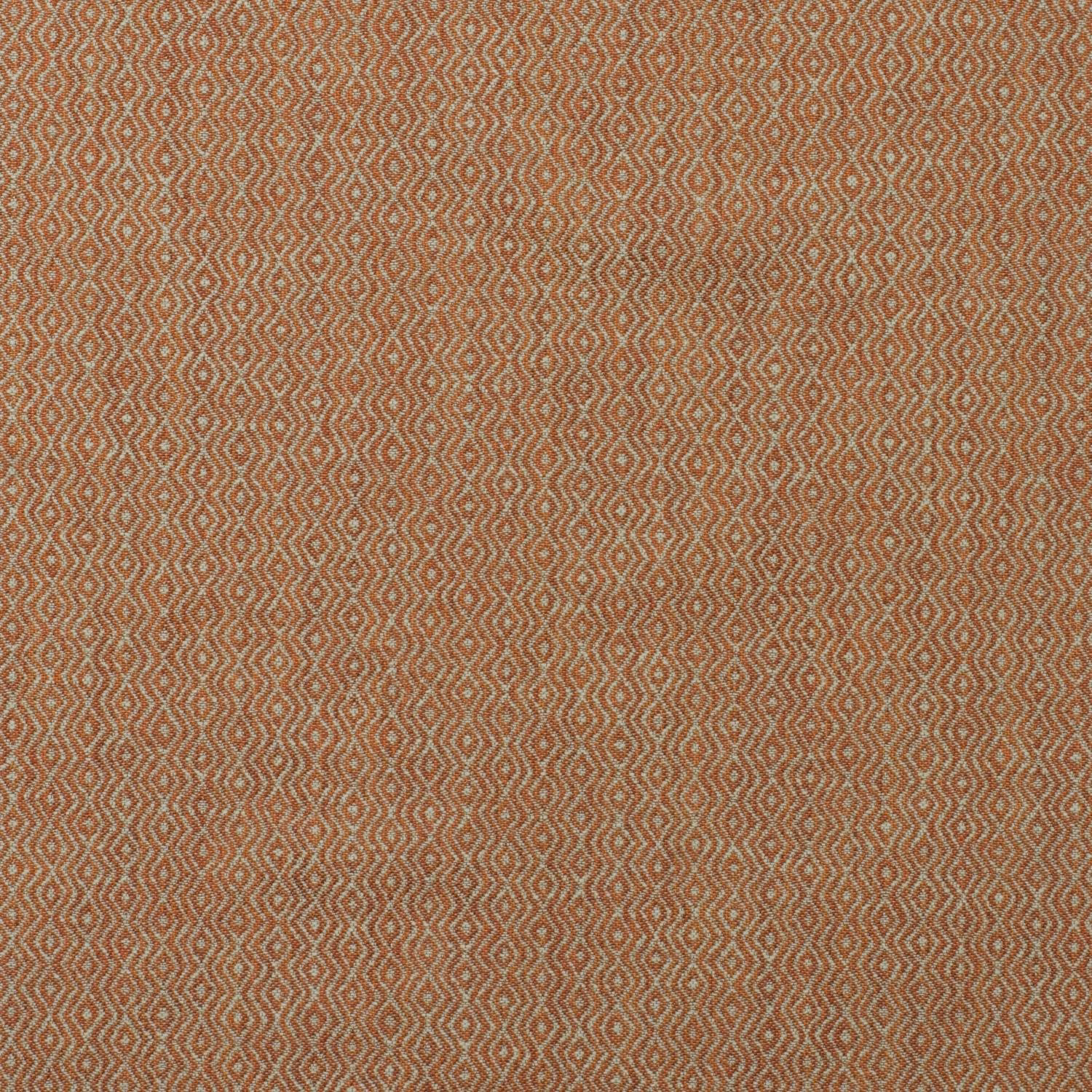 Muted lobster-rust ikat fabric with tiny pale geometric diamonds