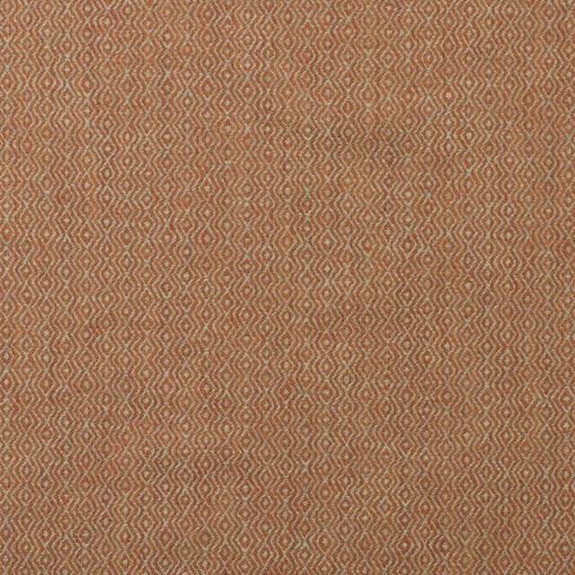 Muted lobster-rust ikat fabric with tiny pale geometric diamonds