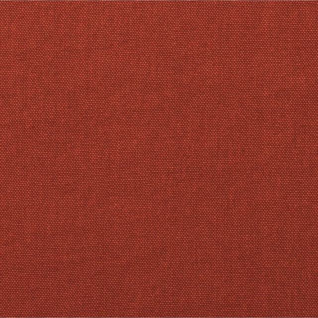 Close-up of warm russet-red fabric with a fine, tightly woven plain texture