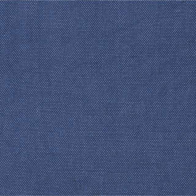 Close-up of muted denim-blue fabric with a dense, fine woven texture