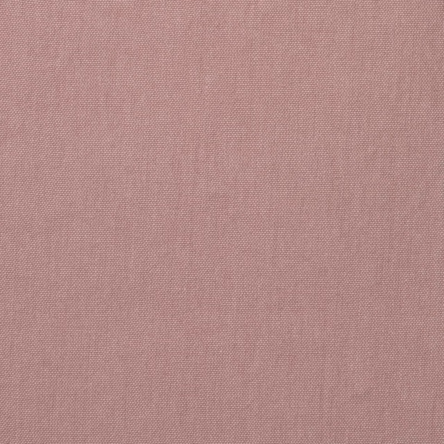 Close view of dusty rose pink plain weave with a fine linen-like texture