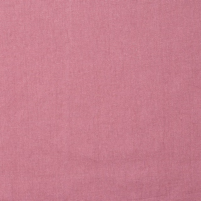 Close-up of muted rose pink Rocco fabric showing a fine plain weave texture
