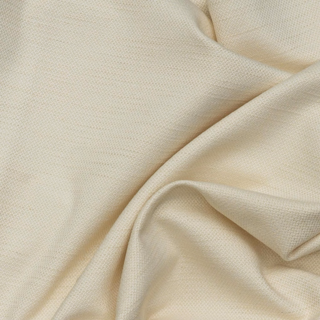 Off-white chalk fabric with fine herringbone texture gathered into soft folds