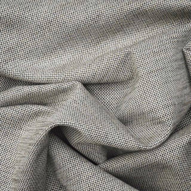 Dark grey herringbone textile with a tightly woven, lightly flecked surface