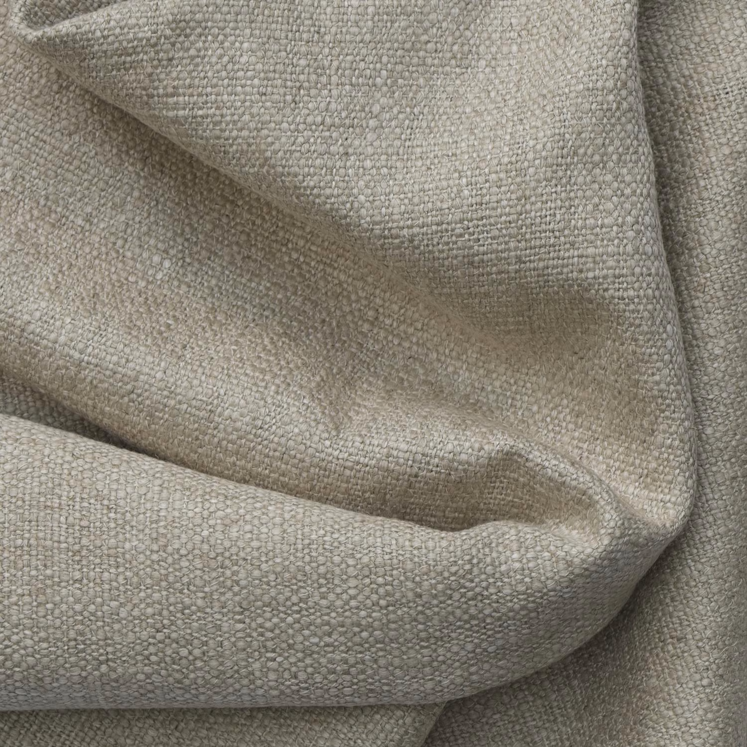 Warm greige woven fabric with a small pebbled texture gathered into soft folds