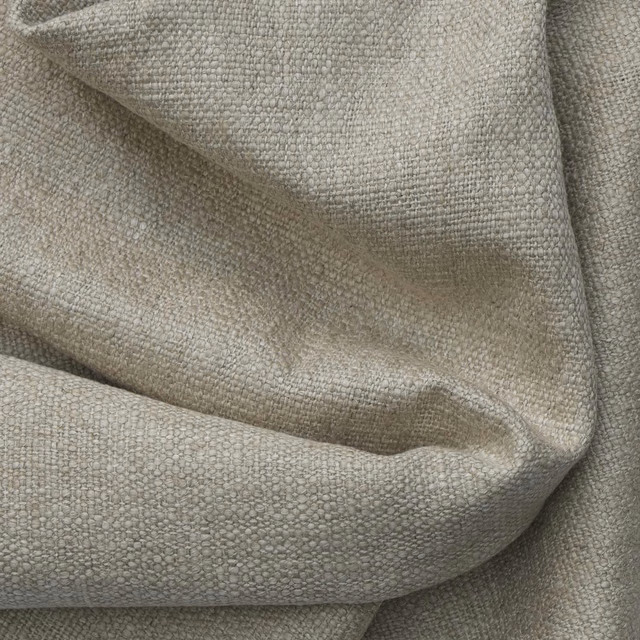 Warm greige woven fabric with a small pebbled texture gathered into soft folds