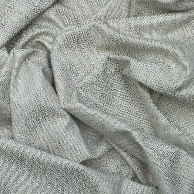 Soft grey fabric with fine dark flecks and a small-scale woven texture
