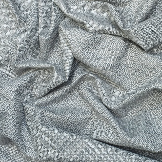 Cool charcoal-grey patterned weave fabric draped in softly textured folds