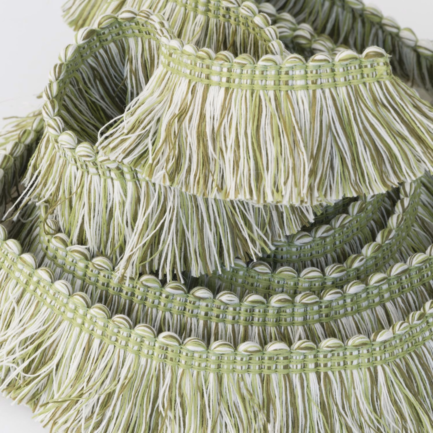 Olive and cream outdoor fringe trim with layered looped bands and long tassels