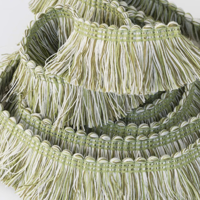 Olive and cream outdoor fringe trim with layered looped bands and long tassels