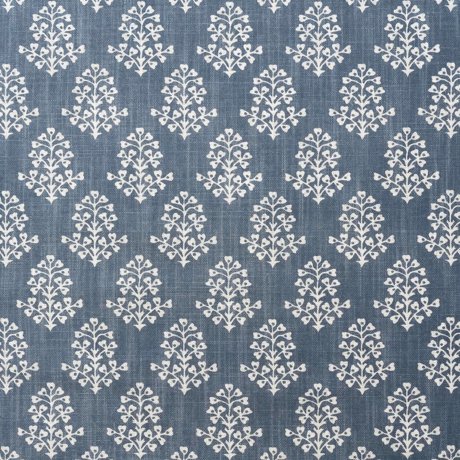 Muted denim-blue textile with ivory sprig motifs and a softly slubbed weave