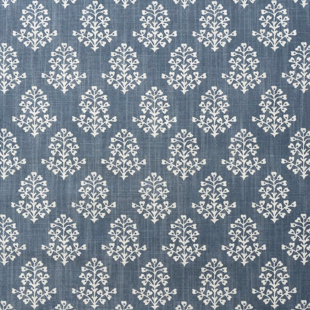 Muted denim-blue textile with ivory sprig motifs and a softly slubbed weave