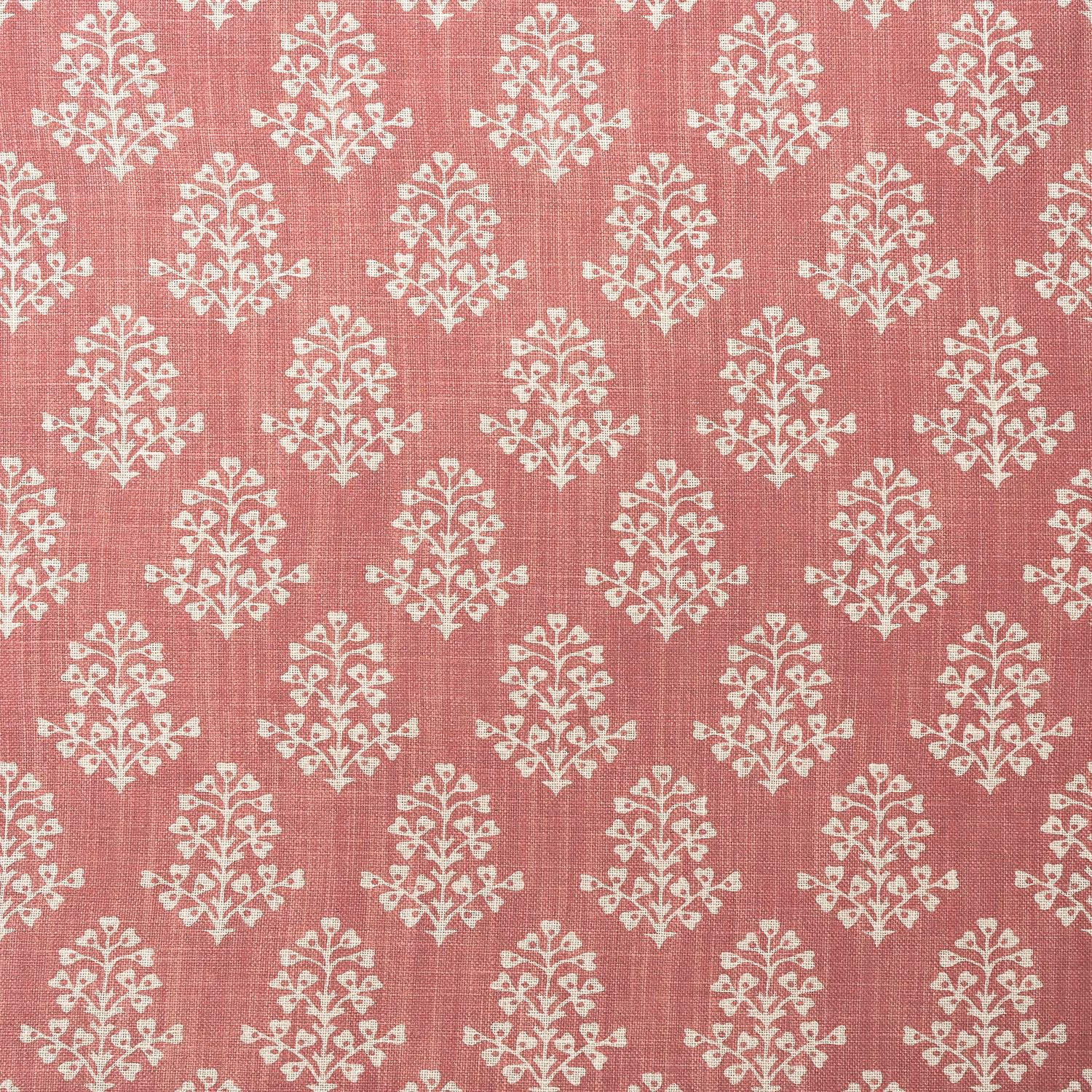 Dusty pink woven fabric with repeated ivory floral sprig motifs