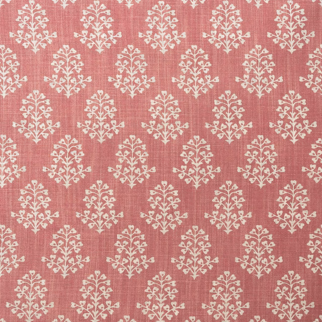 Dusty pink woven fabric with repeated ivory floral sprig motifs
