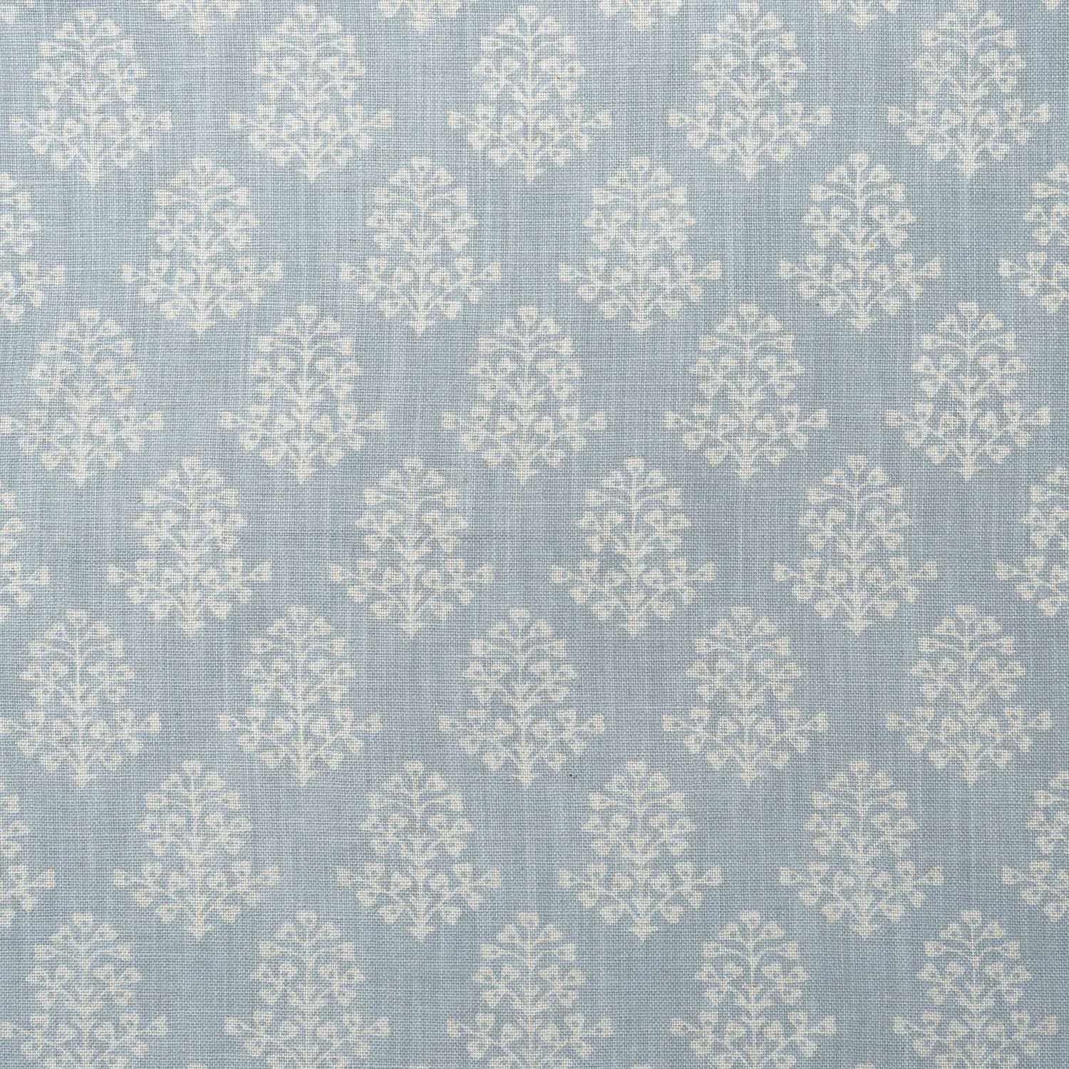 Pale sky-blue woven fabric with repeated chalky ivory botanical sprig motifs