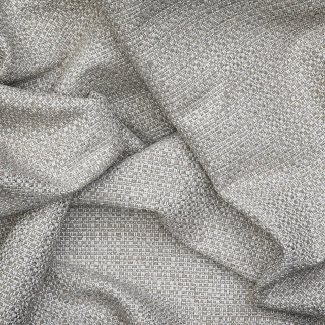 Dark grey woven fabric with fine crosshatched texture and folded surface