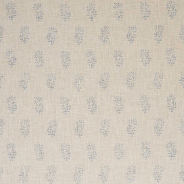 Pale beige woven fabric with repeated muted sage-blue botanical sprigs
