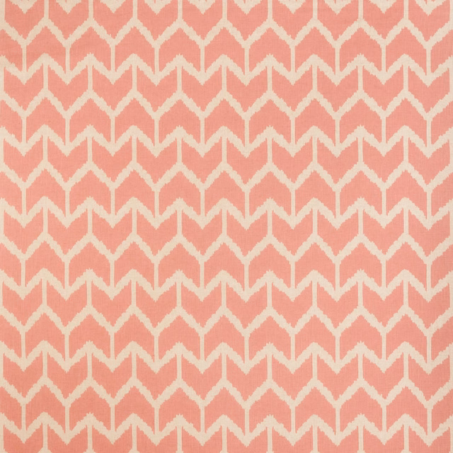 Dusty coral pink fabric with cream angular arches in a woven repeat