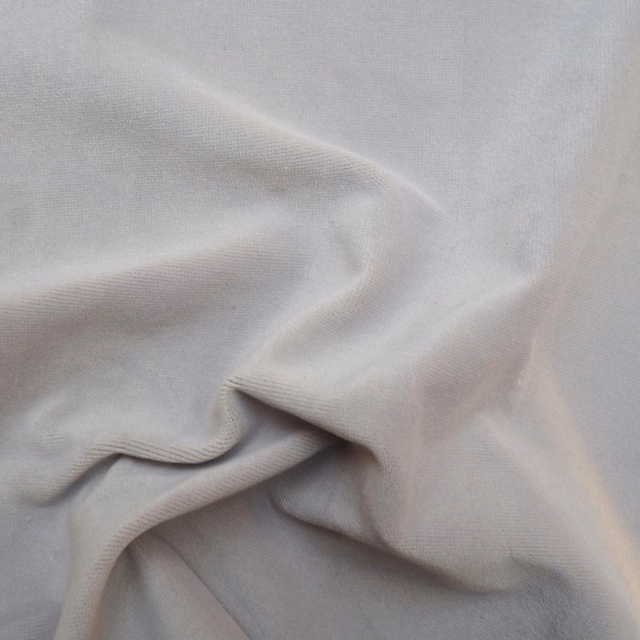 Pale dove-grey fabric with a fine smooth weave folded into soft flowing pleats