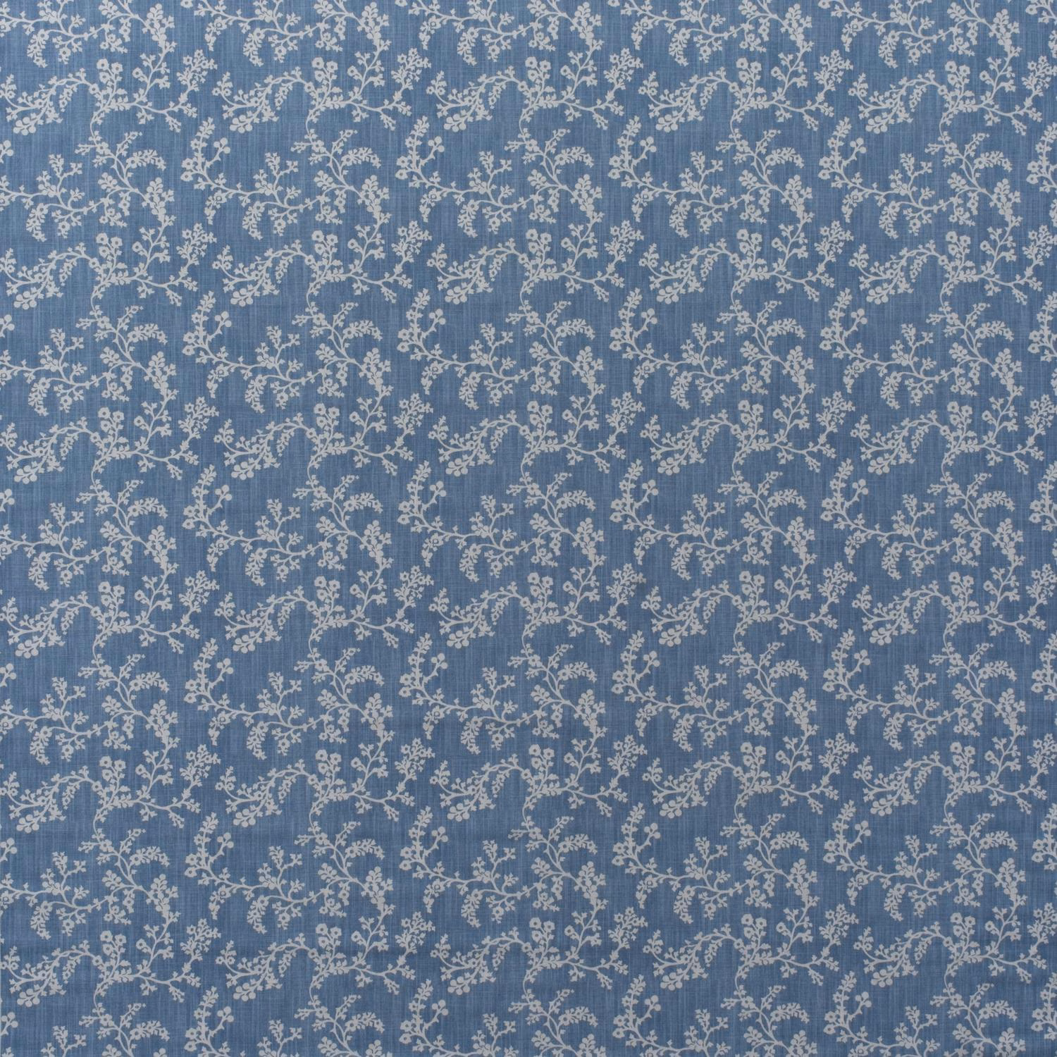 Muted denim-blue cotton with delicate ivory scrolling flowers and leafy vines