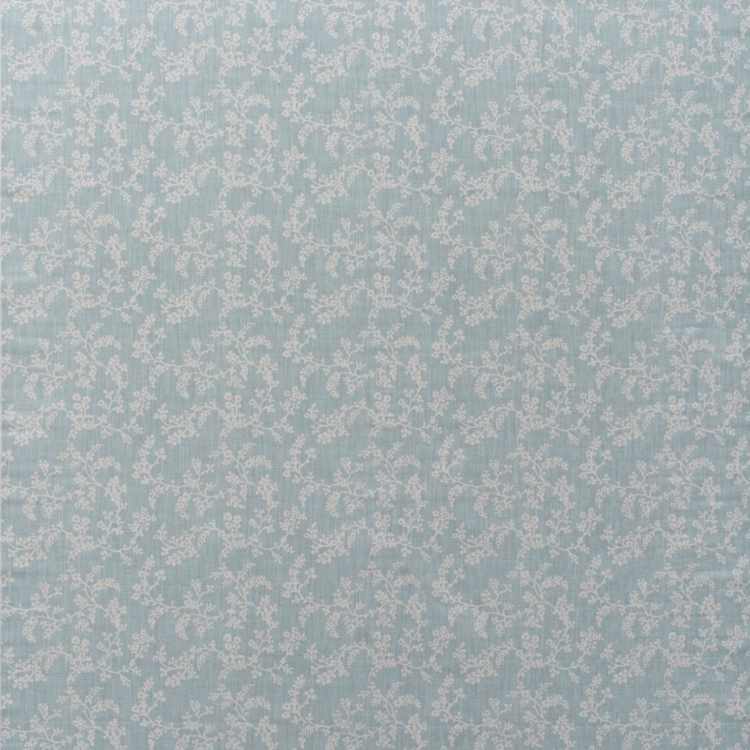 Pale duck-egg blue cotton with small ivory floral vines in a fine all-over print
