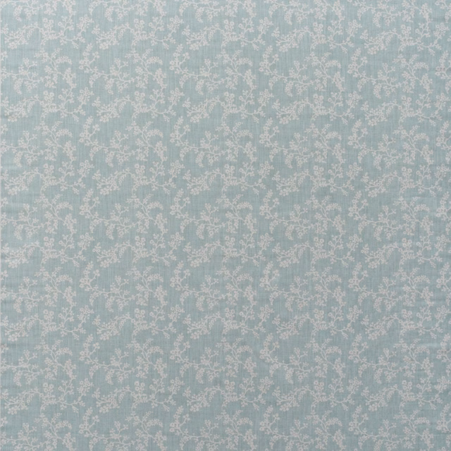 Pale duck-egg blue cotton with small ivory floral vines in a fine all-over print