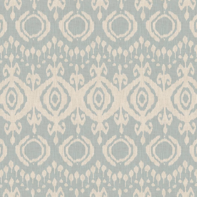 Powder-blue woven fabric with ivory geometric medallions and scrolling motifs