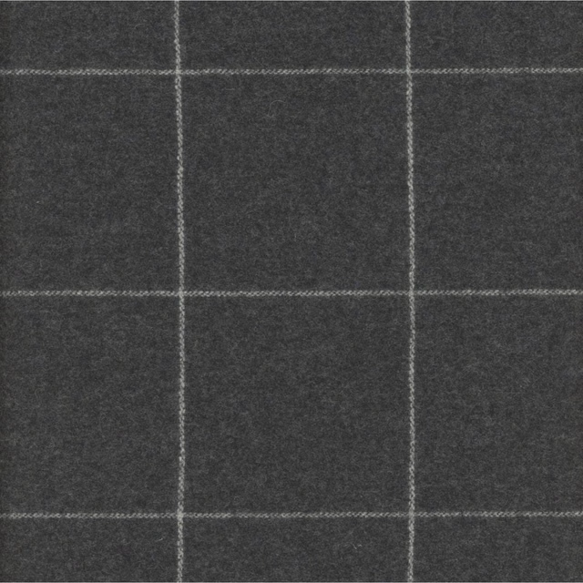 Charcoal grey fabric with a large pale windowpane check and softly mottled texture