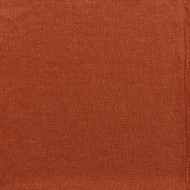 Close-up of warm burnt-orange plain weave with subtle crosshatch texture