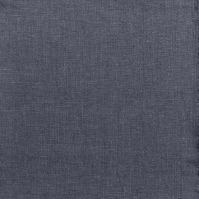 Close-up of dark weathered blue-grey fabric with a fine linen-like crosshatch weave