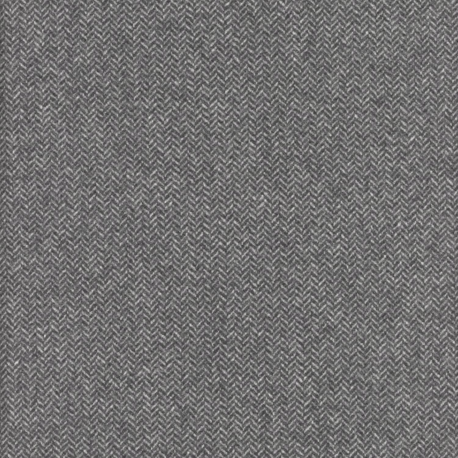 Close-up of charcoal grey fabric with a fine, lighter-thread herringbone weave