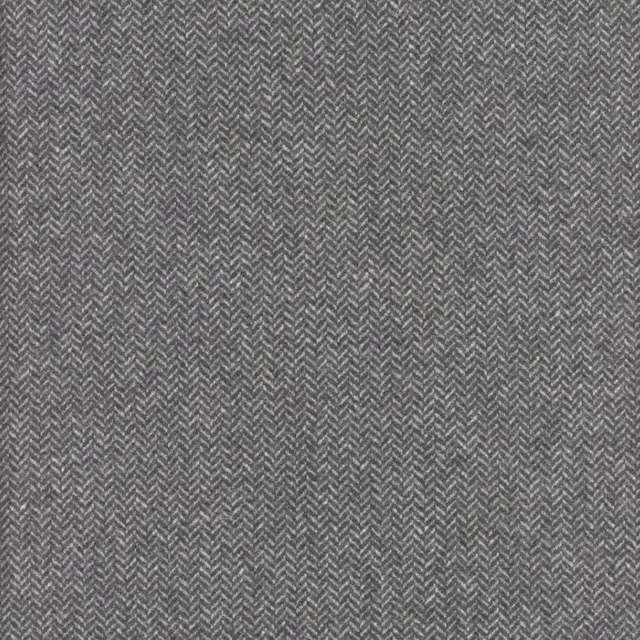 Close-up of charcoal grey fabric with a fine, lighter-thread herringbone weave