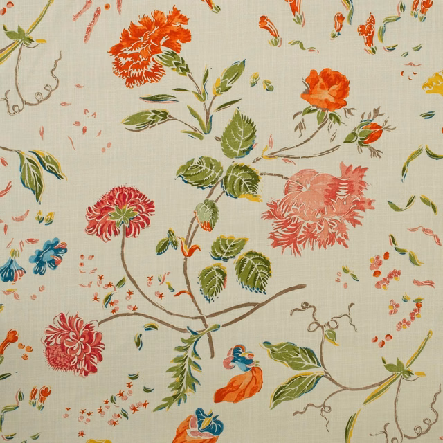 Ivory woven outdoor fabric with coral flowers, green leaves and blue botanical accents