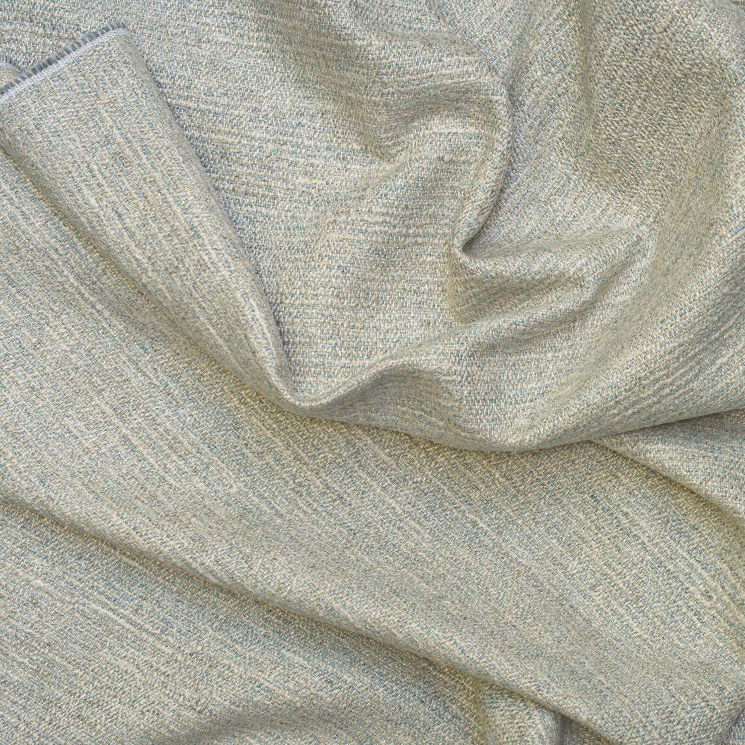 Pale blue-grey textured swatch with fine woven grain arranged in soft folds
