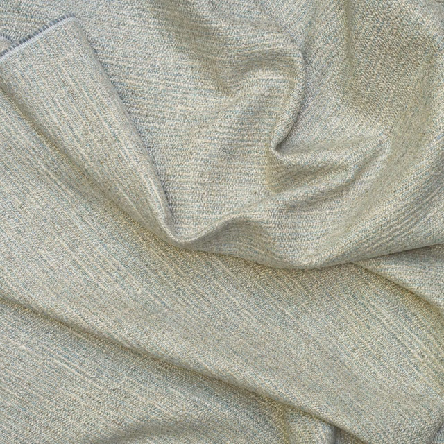Pale blue-grey textured swatch with fine woven grain arranged in soft folds